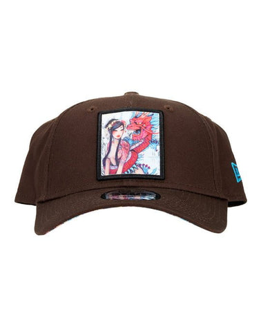 An embroidered tokidoki Gallery Nights Snapback hat featuring a woman and dragon design.