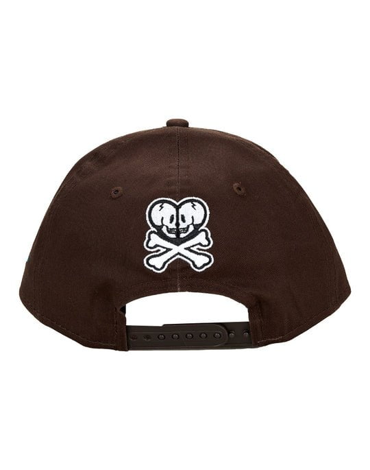 An embroidered brown tokidoki Gallery Nights Snapback hat with a skull and crossbones design.