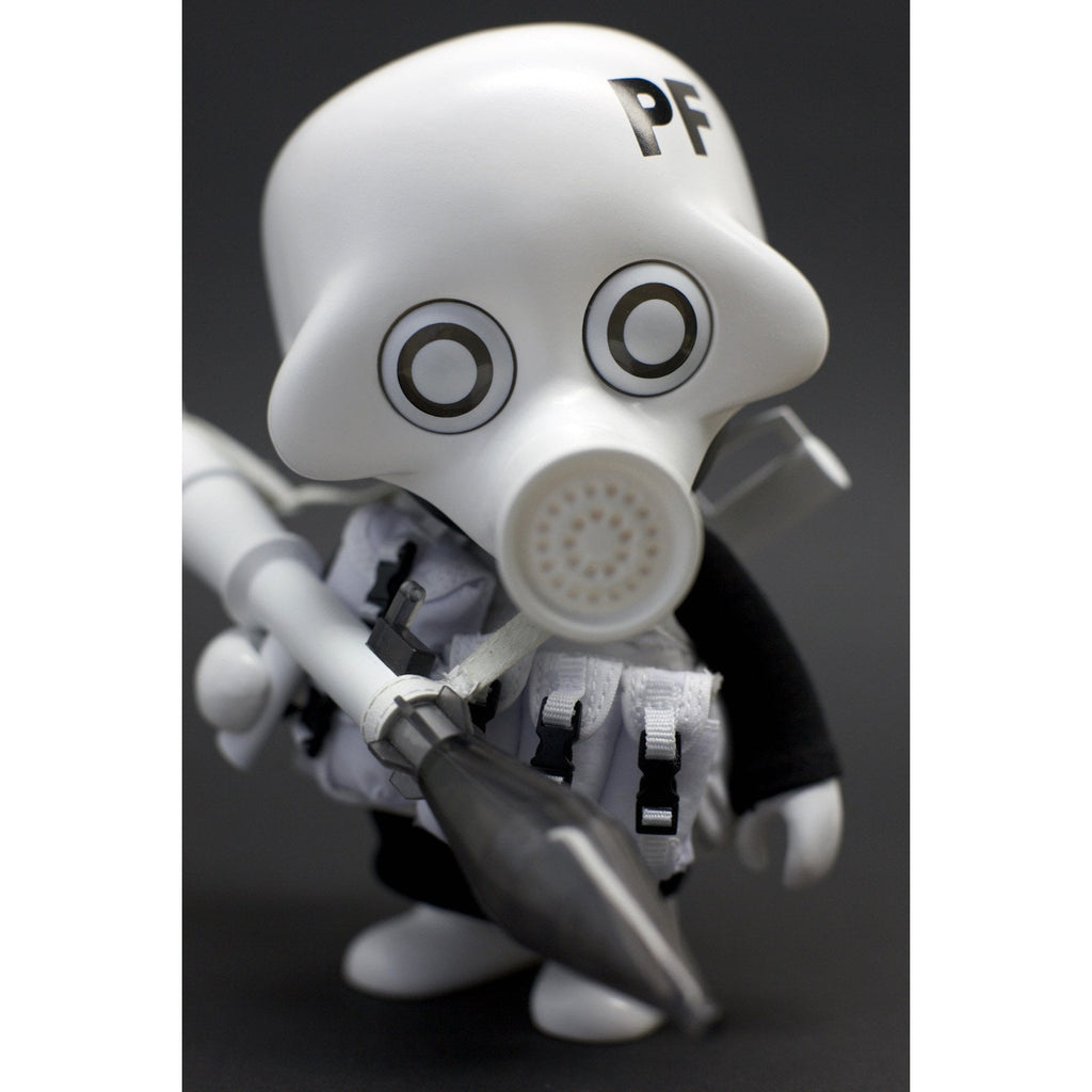 A close-up of a Playge (HK/US) Squadt GERM s006 figurine resembling a cartoonish character in a white mask, with a 