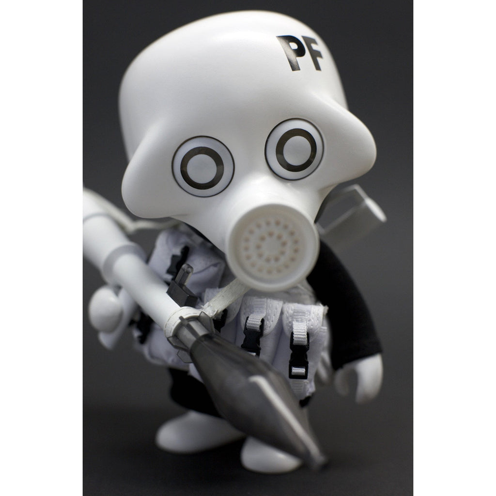 A close-up of a Playge (HK/US) Squadt GERM s006 figurine resembling a cartoonish character in a white mask, with a
