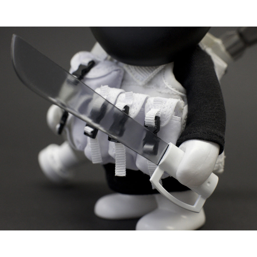 Close-up of a Playge (HK/US) Squadt GERM S006 [PEACE F***ER] toy figure dressed in white tactical gear wielding a knife.