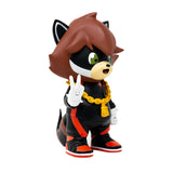 A Richie the Tanuki vinyl figure by Ali Six in a black and red outfit.