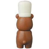 A brown bear wearing a white hat on its head, inspired by Japanese vinyl toy designs, like the VAG Series 28 β Koguma Kekiyasan by Kamentotsu from Medicom (JP).