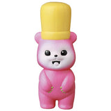 A cute pink toy bear wearing a yellow hat, inspired by Japanese vinyl toys, VAG Series 28 — Koguma Kekiyasan by Kamentotsu from Medicom (JP).