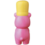 A pink teddy bear with a cute yellow hat, reminiscent of Japanese vinyl toys like the VAG Series 28 - Koguma Kekiyasan by Medicom.