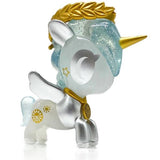 A Pandalina Unicorno collectible toy unicorn with a golden crown by tokidoki.