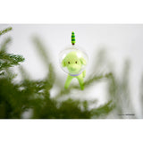A green Puppy Tang from the Little Forest series hangs from a tree.