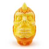 An orange skull shaped Skully Ghost — Candy Corn toy on a white background by Squibbles Ink (US).