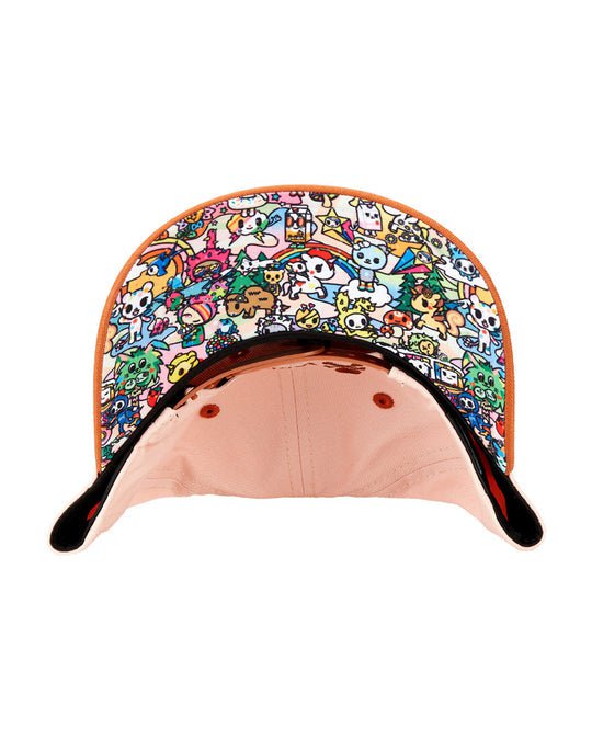 A Stay Wild Snapback hat with tokidoki characters on it, featuring an adjustable strap for the perfect fit.