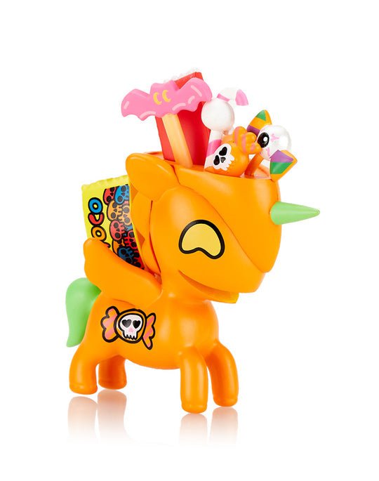 A tokidoki Unicorno After Dark Series 3 Blind Box toy with candy in its mouth.
