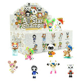 A display of various animal figures in front of an All Star Champs Blind Box by tokidoki.