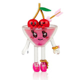 Sentence with replaced product and brand name: A quirky toy with a cherry in a martini glass, inspired by tokidoki's Boozy Besties Blind Box.