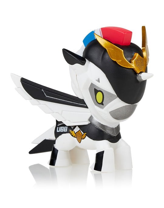 A black and white toy with a golden horn, inspired by the Space Unicorno Blind Box from tokidoki.