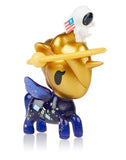 A gold tokidoki Space Unicorno Blind Box toy with an American flag on it.