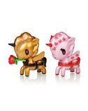 Two Tokidoki Sweet Heart Unicornos with a flower on their heads, perfect for Valentine's Day.
