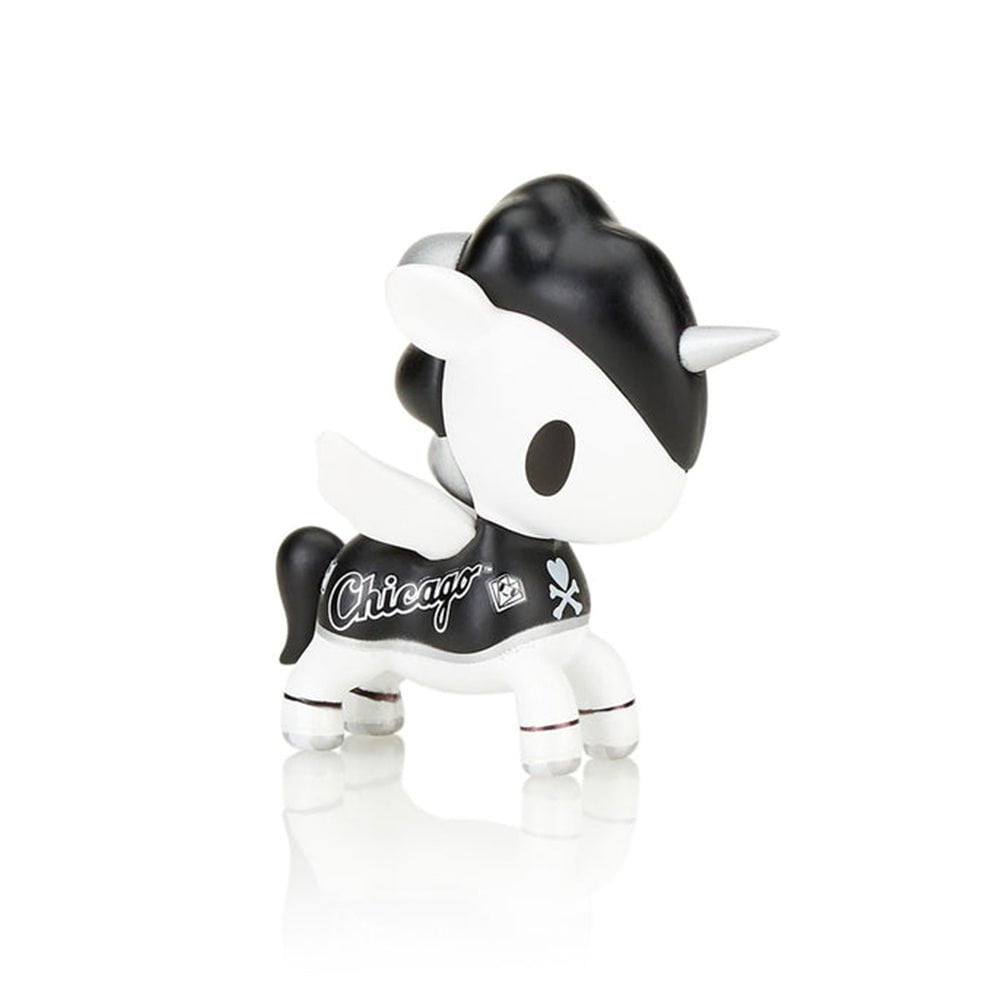 A black and white tokidoki x MLB Chicago White Sox Unicorno 2022 toy on a white surface, representing Chicago pride.