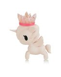 The Tokidoki Precious Unicorno - Pink Aura Amethyst (Special Edition) is a small white unicorn figurine adorned with a pink crystal crown, pink wings, and a pink tail, exuding enchanting elegance on a white background.