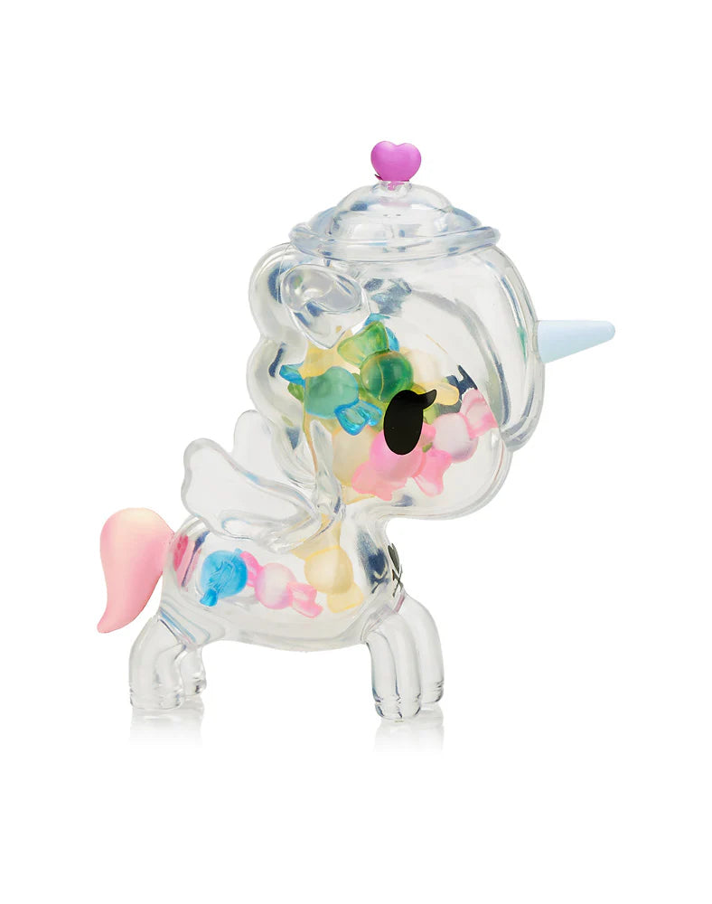 The Tokidoki Sugar Shop Unicorno Blind Box figurine enchants with pastel hues swirling in its clear design, featuring a heart-topped lid and delicate wings.