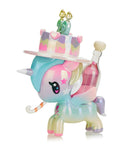 The Tokidoki 20 Candles Unicorno Special Edition figurine, by Tokidoki, celebrates their Twentieth Anniversary with a birthday cake hat adorned with candles and a drink bottle on its back.