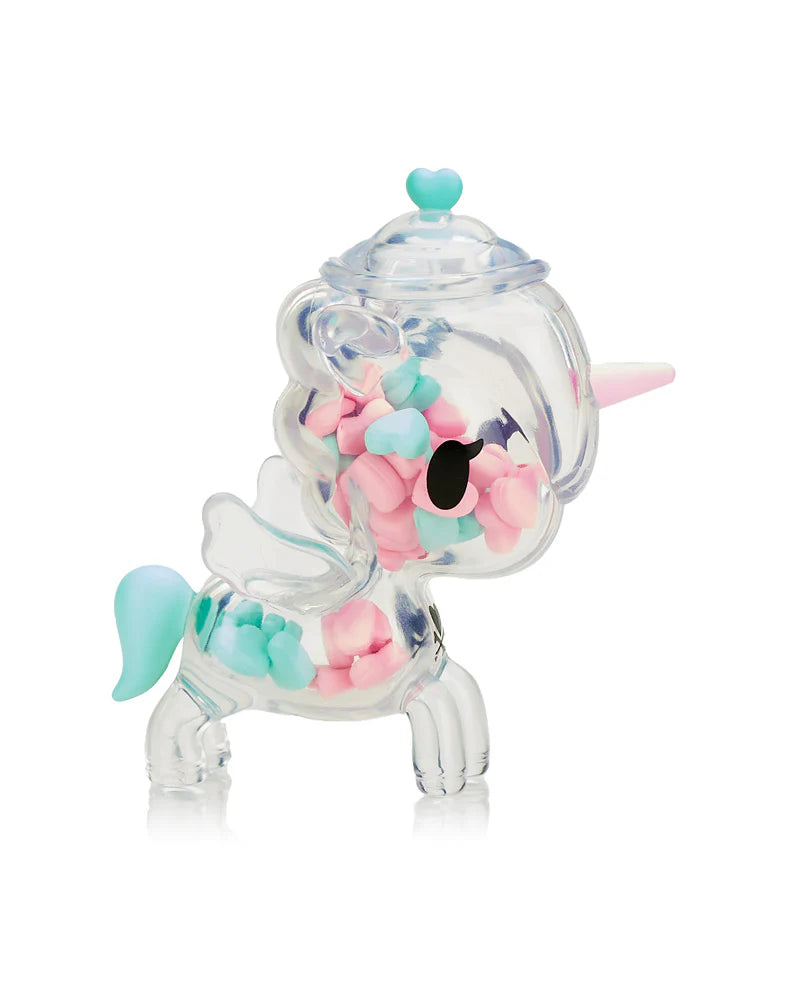 The Tokidoki Sugar Shop Unicorno Blind Box features a transparent unicorn container full of pink and teal heart candies.