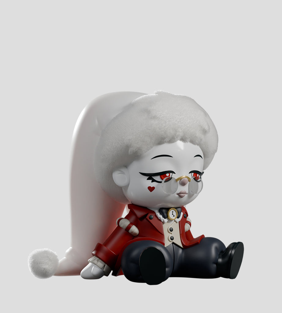 The A Mad Tea Party Blind Box by Kaleidos Creative features a stylized circus clown doll with white skin, a fluffy hat, red jacket, glasses, and a heart on its cheek—perfect for any blind box collection.