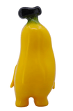 Banana Boo - Yellow by Rotofugi is a cute, yellow, cartoon-style banana figure with a black stem and two legs—perfect as a grocery-themed plush or collectible for fans of playful designs.