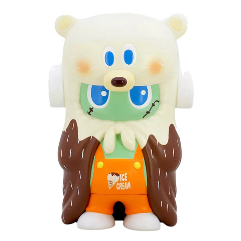 The BG Bear x Frankenskid- Orange vinyl toy by Rotofugi features a green face, large blue eyes, a white bear hat, and an orange "Ice Cream" outfit with brown and white chocolate-vanilla drips.