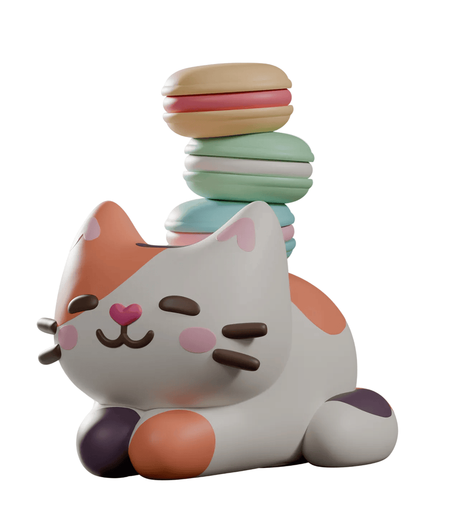 The Bake Me A Cat Blind Box by Kaleidos Creative features adorable pastel cat figurines with closed eyes and colorful macarons, ideal for fans of whimsical bakery-inspired collectibles.