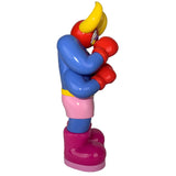 Side view of The Little Hut (HK)'s Lazy Boxer (OG), an 8-inch colorful cartoon figure with horns, red gloves, blue shirt, pink shorts, and big pink boots, standing upright against a white background.