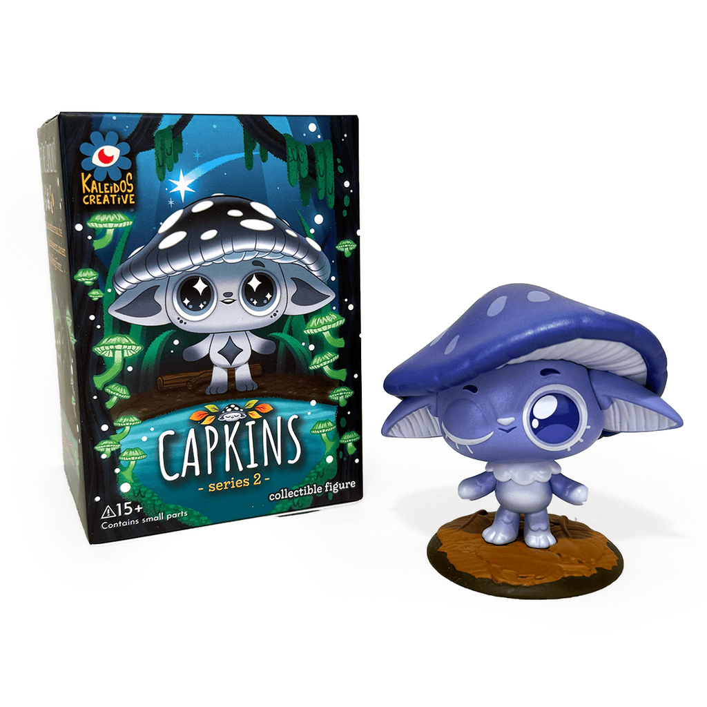 A Capkins — Series 2 Blind Box figure by Kaleidos Creative, featuring a large purple mushroom hat, is shown beside its illustrated Fungi Forest packaging on a white background.
