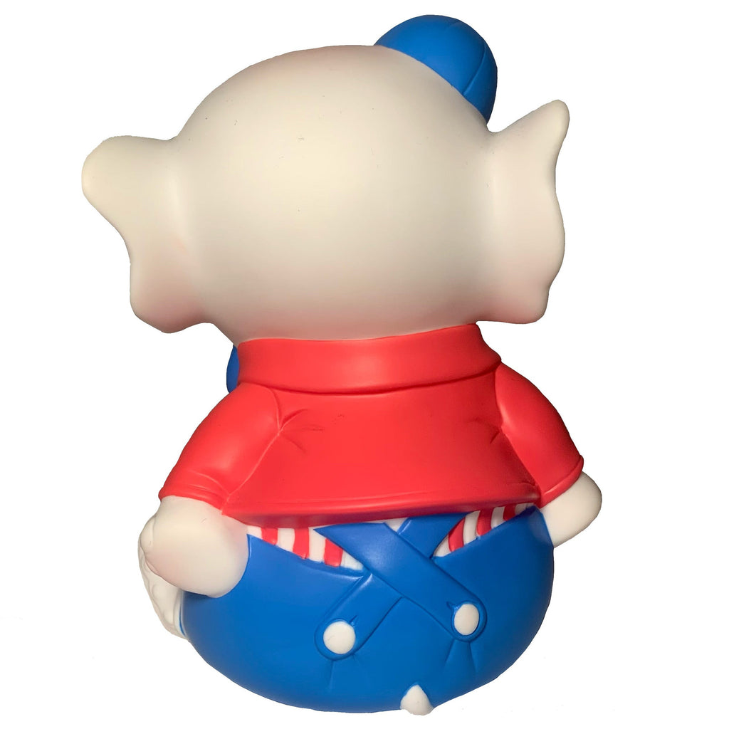 A rear view of the Carnival Stripes Baby Elephant figurine by Bitter Squeaks (US), featuring a cartoon baby elephant in a red shirt, striped suspenders, blue pants, blue hat, and bowtie, isolated on white.