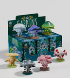 Seven vibrant mushroom-themed vinyl figures from Kaleidos Creative’s Capkins — Series 2 Blind Box encircle the branded box—ideal for fans of whimsical Fungi Forest collectibles and blind box surprises.