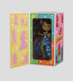 Chikitas! — Rumberita by Kaleidos Creative is a stylized female doll inspired by Golden Age Mexican cinema, dressed in a blue polka dot outfit and showcased in a vibrant open box with silhouettes and stars.