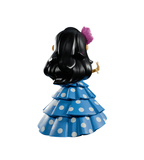 The Chikitas! — Rumberita figurine by Kaleidos Creative features a girl with long black hair, a pink flower, and a blue polka-dot ruffled dress, capturing Golden Age Mexican cinema charm—shown from the back on a white background.