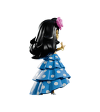 The Chikitas! — Rumberita toy by Kaleidos Creative features long black hair, a pink flower accessory, and a blue polka dot ruffled dress, capturing the charm of Mexico’s Golden Age cinema from the back view.