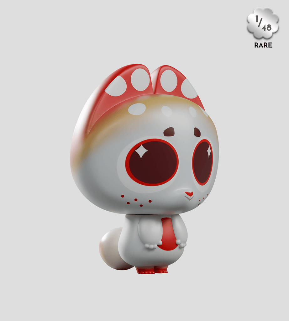 A vinyl toy figure with large red eyes, red and white markings, and a cat-like look stands on a plain light gray background. It's from the Kaleidos Creative Dump Blind Box series, marked as 