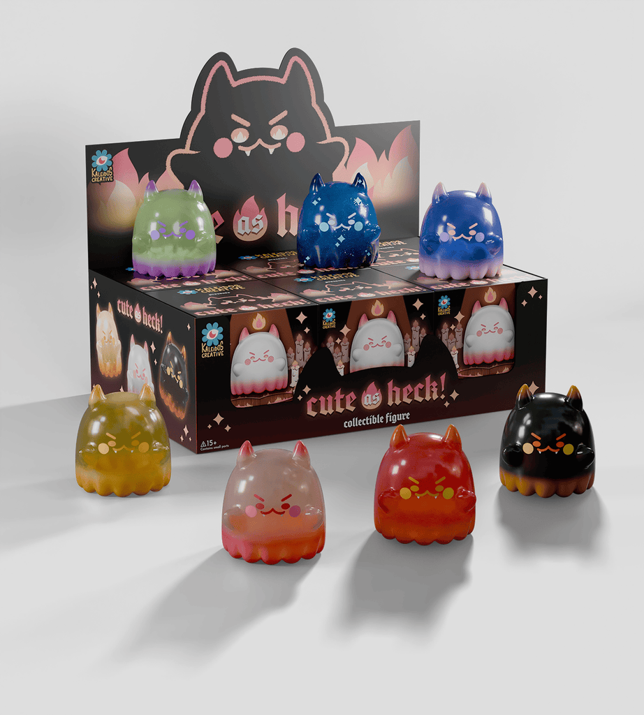 Six small cat-shaped figures from the Cute as Heck! Blind Box by Kaleidos Creative are displayed in front of the box featuring matching cat designs—open one to see which unique collectible you get, and maybe you'll find a rare!.