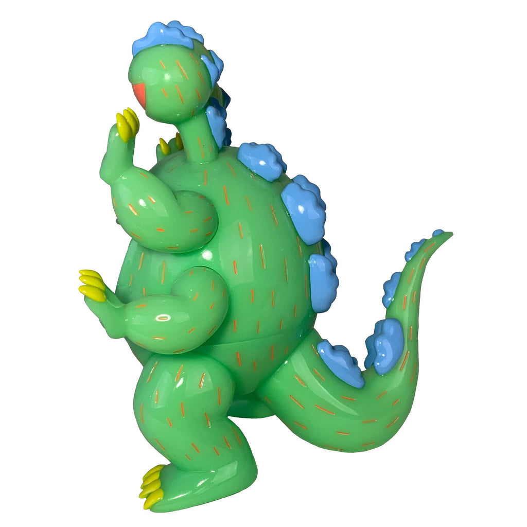 Dinosuke Green by Paradise Toy (TW) is an 8-inch green vinyl cartoon dinosaur with blue spikes, yellow claws, and orange stripes—a playful collectible figure perfect for dino fans and collectors.
