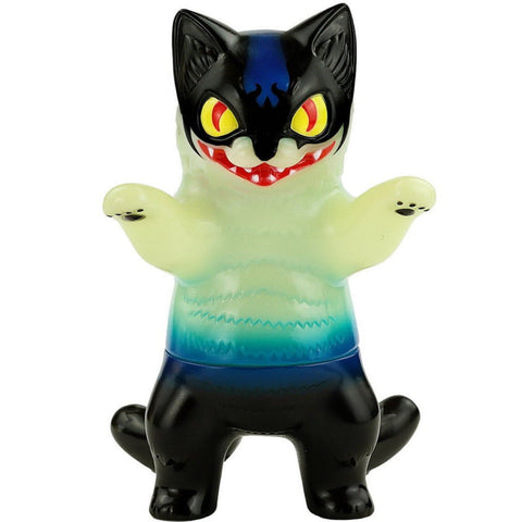 The Konatsuya Devilman Negora is an anime-inspired collectible toy with black ears, tail, and legs, blue markings, large yellow eyes, a sharp red mouth with fangs, and raised arms showing its claws.
