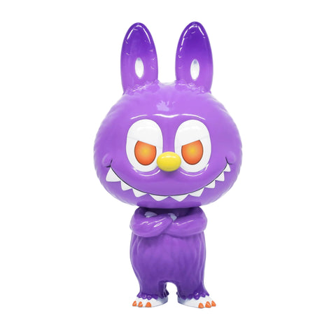 The Cowawa — MET by How2Work is a shiny purple cartoon creature with bunny ears, orange and red eyes, a yellow nose, sharp teeth, and crossed arms standing facing forward.