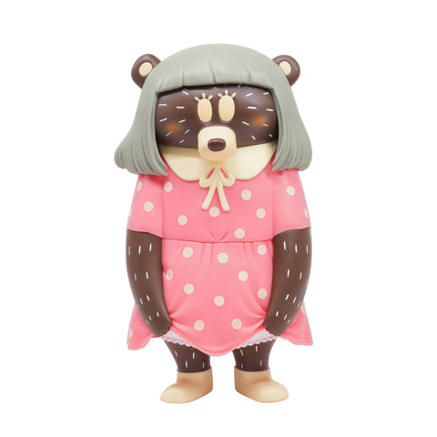The How2Work Don't Look Bear — Pink Dress is a cartoon figurine featuring a bear with a gray bob haircut, dressed in a pink polka dot dress and standing upright.