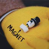 A Gangster Doodles GARF Vinyl Toy head with a black hat and mustache sits on a yellow glove, highlighted by an arrow labeled 