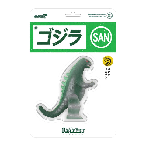 Packaging of a Super 7 Toho Marusan ReAction - Godzilla (Green/Silver) toy, labeled in Japanese with the word "san" in bold green text, accompanied by a smiling emoji sticker.