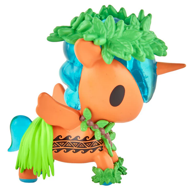 An orange unicorn figurine with a blue mane, green leafy crown, grass skirt, patterned leg band, and wings faces left. Part of the tokidoki Hawaiian Ohana Blind Box series.