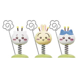 Three Chiikawa Little Bee Wobble figures on green bases, each with a metal spring wire topped with a flower-shaped note holder.
