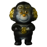 The VAG 40 — Norakoinu Dog is a small, anthropomorphic gachapon figure from Medicom (JP), featuring round ears and a smiling face while holding a gold item. Its dark body with lighter highlights reflects the unique charm of Japanese vinyl toy artists.