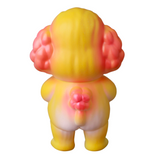 This VAG 40 — Norakoinu Dog by Medicom (JP) showcases a whimsical Japanese vinyl toy character with a yellow body, pink ears, and tail, as seen from the back.