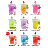 The tokidoki Beverage Besties Unicorno Blind Box includes nine collectible keychain drink charms with playful animal designs, each featuring a unique flavor, arranged in a 3x3 grid.