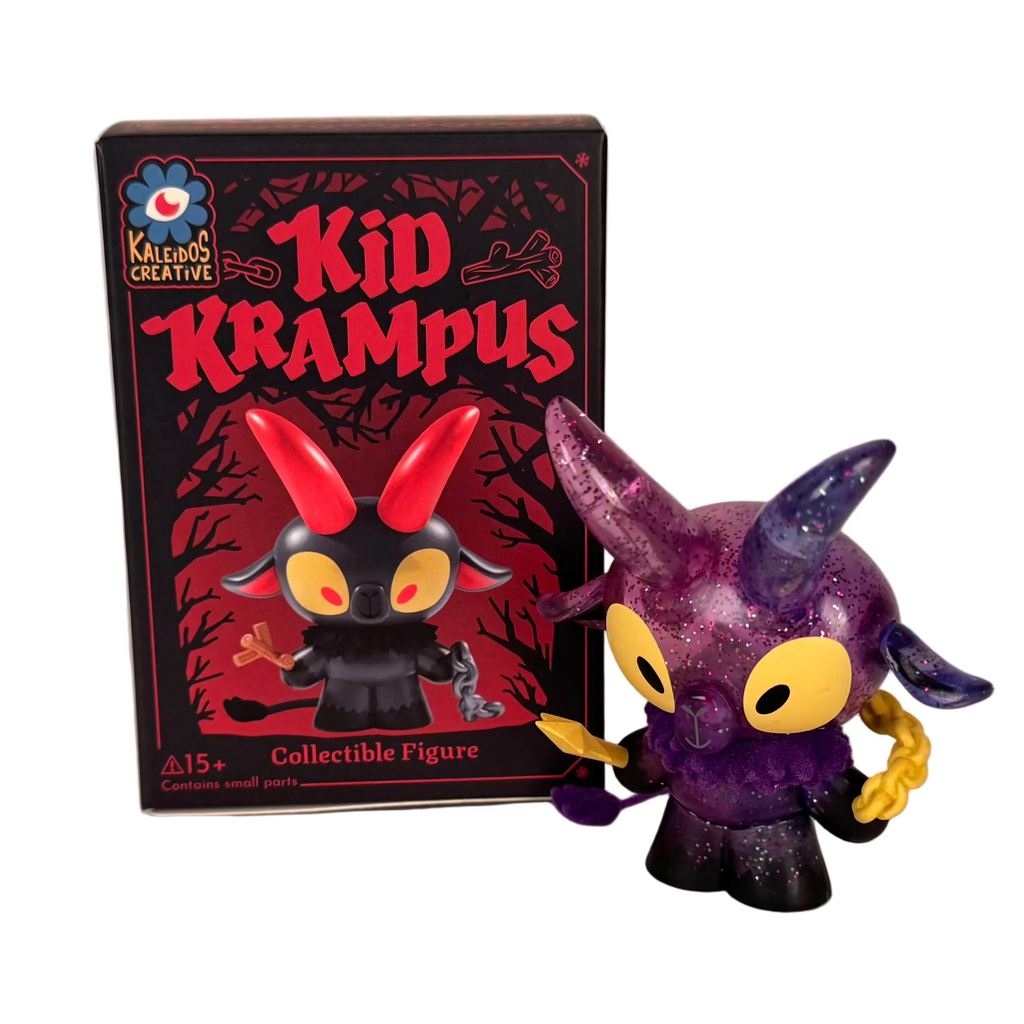 A Kid Krampus Blind Box figure by Kaleidos Creative, featuring purple and black colors, stands beside its box displaying the character’s illustration with “Kid Krampus” and “Collectible Figure” text.
