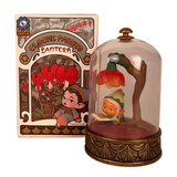 A collectible fairy figurine reads under a flower-shaped LED lantern inside a glass dome. The illustrated box, labeled 